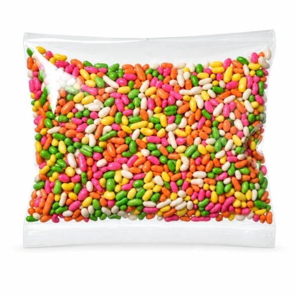 Colourful saunf in a clear pouch on a white background